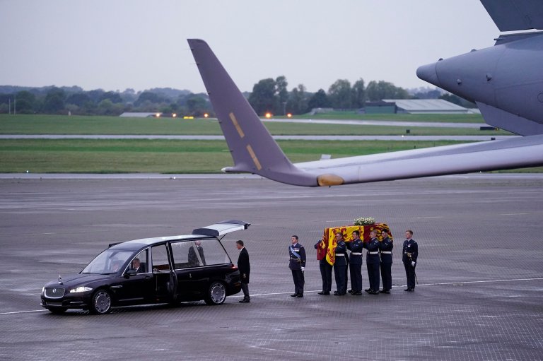 Queen Elizabeth II coffin being moved from hearse to military plane following death in Scotland