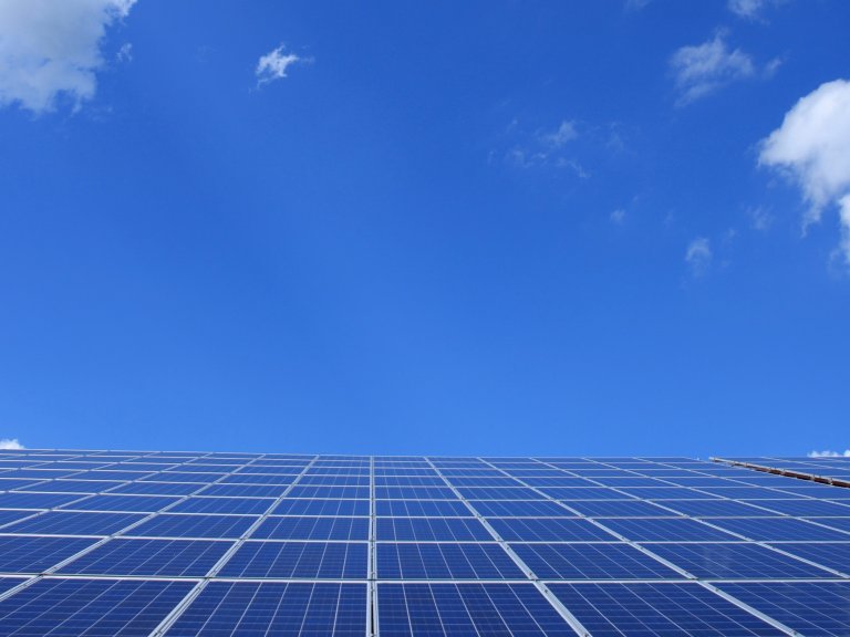solar panels against a blue sky