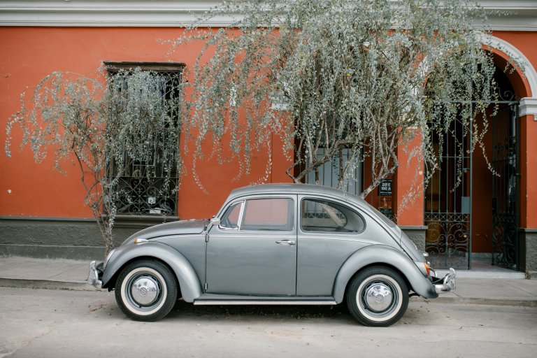 Vintage VW bug parked on the street.