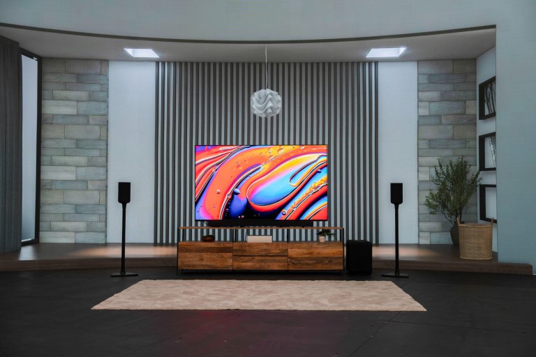 A Sony television with home theater set-up staged in a pretend living room.