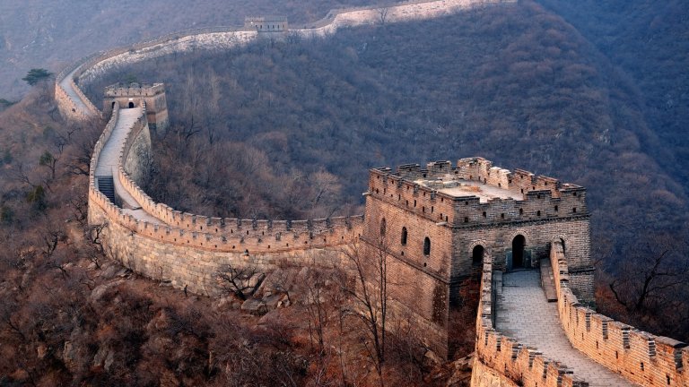 Aerial view of Great Wall of China surrounded by forests