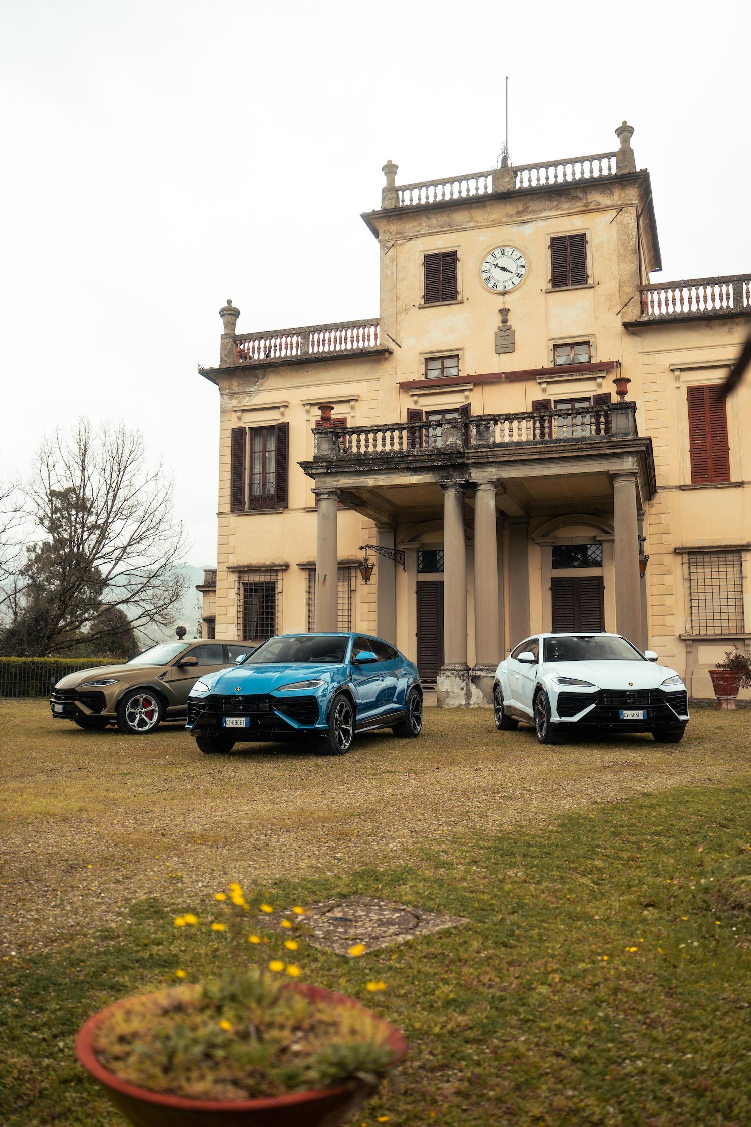 three cars parked in front of italian villa