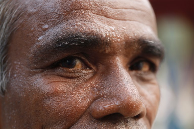 A man is sweating during a heatwave in Dhaka, Bangladesh, on April 28, 2024. (Photo by Rehman Asad/NurPhoto via Getty Images)