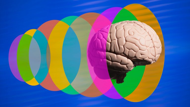 Human brain going through translucent multi colored discs blue background